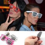 Novelty pinhole eyeglasses in pink and white, featuring unique designs and mesh lenses, ideal for fun parties.
