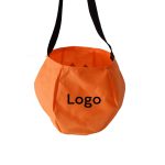 An orange bag with a rounded shape and a black strap, featuring a logo on the front.