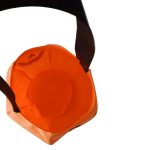 An orange pumpkin-shaped candy bag with a black handle, featuring a simple pumpkin face design.