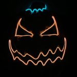 A Halloween pumpkin mask featuring glowing orange and blue accents, with a menacing expression.