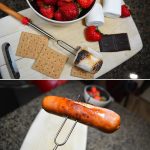 A telescopic barbecue fork with a red handle, shown with roasted marshmallows, strawberries, chocolate, and crackers.