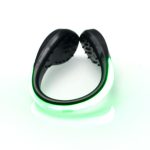 A green LED clip-on shoe light with a black plastic base, designed for outdoor leisure activities.