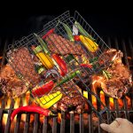 A barbecue net holding grilled vegetables and meats above glowing coals, featuring a black wire design.