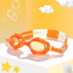 Children's swimming glasses in bright orange with soft straps. Features a fun design with rounded lenses.