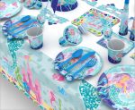A set of customised disposable party tableware featuring blue mermaid designs, including cups, plates, cutlery, and napkins.