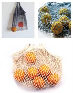 A cotton mesh bag in grey, blue, and cream, filled with oranges. Each bag has a logo.