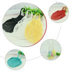 A collection of cotton mesh bags in various colours: black, white, yellow, red, and teal. Each has a handle and a logo.