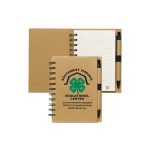 A recycled brown notebook with a pen, featuring spiral binding and lined pages. It includes a logo on the cover.