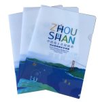 A set of three transparent plastic pocket folders in blue and white, featuring a scenic design and a logo.