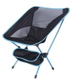 A folding fishing chair in black with blue accents and a side pocket, featuring a lightweight design.