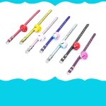 A selection of pet collars with bells in various colours including red, yellow, pink, blue, black, and purple.