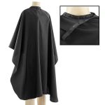 A black hair cutting smock with a high collar and snap closures, displayed on a mannequin.