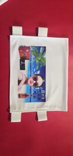 A white fabric advertising cover featuring a tropical beach scene, sunglasses, and branding logos.