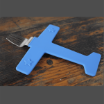 A blue airplane-shaped fork with a stainless steel prong, featuring star designs on the wings.