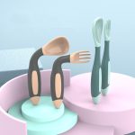 A set of baby fork and spoon in pastel green and beige, displayed on a light blue and pink geometric background.
