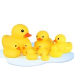 A collection of yellow rubber ducks in various sizes, featuring a playful design with black eyes and orange beaks.