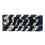 A fidget keyboard featuring a black and white zebra-striped design with poppable keys.