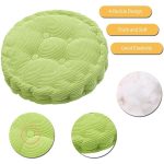 Round seat cushion in vibrant green colour with a textured surface, featuring a four-buckle design for added support.