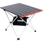 A portable camping table with a black surface and red accents, featuring a lower black storage bag and silver legs.