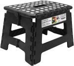 A black folding step stool with white dots on the surface, featuring a compact design and a logo.