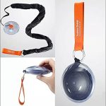 A folding telescopic storage bag with an orange handle and a black strap, featuring a clear circular casing.