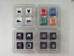Colourful arrow keycaps arranged in a plastic tray, featuring various artistic designs and colours.