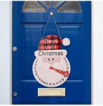 A decorative Christmas calendar ornament featuring a snowman design with red and black plaid, hanging on a blue door.