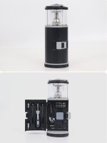 A black LED lantern with a clear top, featuring an integrated tool set inside. It includes various tools and accessories.