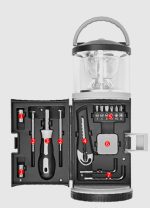 An expedition LED lantern in black and grey, featuring a detachable tool set with various tools inside.