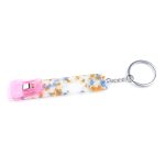 A keychain featuring a colourful, speckled design with a pink clip and a silver keyring.