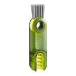 A drink bottle brush in green and grey with bristles for cleaning, featuring a logo on the body.