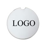 A round, white car coaster featuring a logo in the centre.