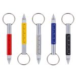 A 6-in-1 pen featuring red, yellow, blue, and black coloured bodies, each with a keyring attachment and ruler markings.