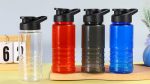 A drink bottle collection featuring clear, red, olive green, and blue bottles, each with a black drink-thru lid.