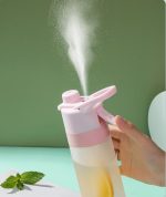 A drink bottle in pink and clear, featuring a spray nozzle releasing a fine mist. It includes a branding logo.