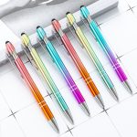 A set of six stylus pens in gradient colours, featuring metal bodies and rubber tips, displayed on a flat surface.