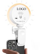 A compact white lighting kit attaches to a smartphone, featuring adjustable brightness and a minimalistic design.