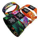 Four 1'' RPET elastic wristbands in vibrant designs, featuring various colours and patterns, each with a logo.
