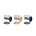 A manual mashing and grinder in three colours: brown, yellow, and navy blue, featuring a clear compartment and a handle.