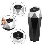 A black and silver geometric trash can with a push lid and interior compartment. It features a logo on top.