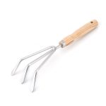 A garden fork with a wooden handle and three metal tines, ideal for cultivating soil and gardening tasks.