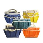 A set of five multi-coloured garden totes in blue, green, yellow, orange, and navy, featuring multiple pockets and sturdy handles.