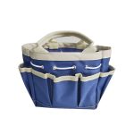 A blue and cream garden tote with multiple pockets and sturdy handles. It has a branding logo on the side.