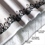 A beach towel featuring a solid colour design, with a decorative trim and a firm seam. It is soft and skin-friendly.