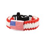 A flag pattern paracord bracelet in red and white, featuring a black clasp and a small flag detail.