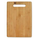 A large bamboo cutting board with a handle cutout, featuring a smooth surface and natural wood grain.