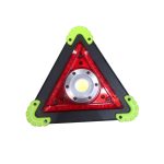 A triangular warning lamp in red and black with green rubber corners, featuring a central light. Contains a logo.