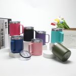 A collection of 12 oz. travel mugs in various colours, including pink, black, purple, teal, and green, with lids.