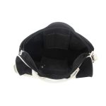 An open black and white duffle bag showcasing multiple interior pockets and compartments.