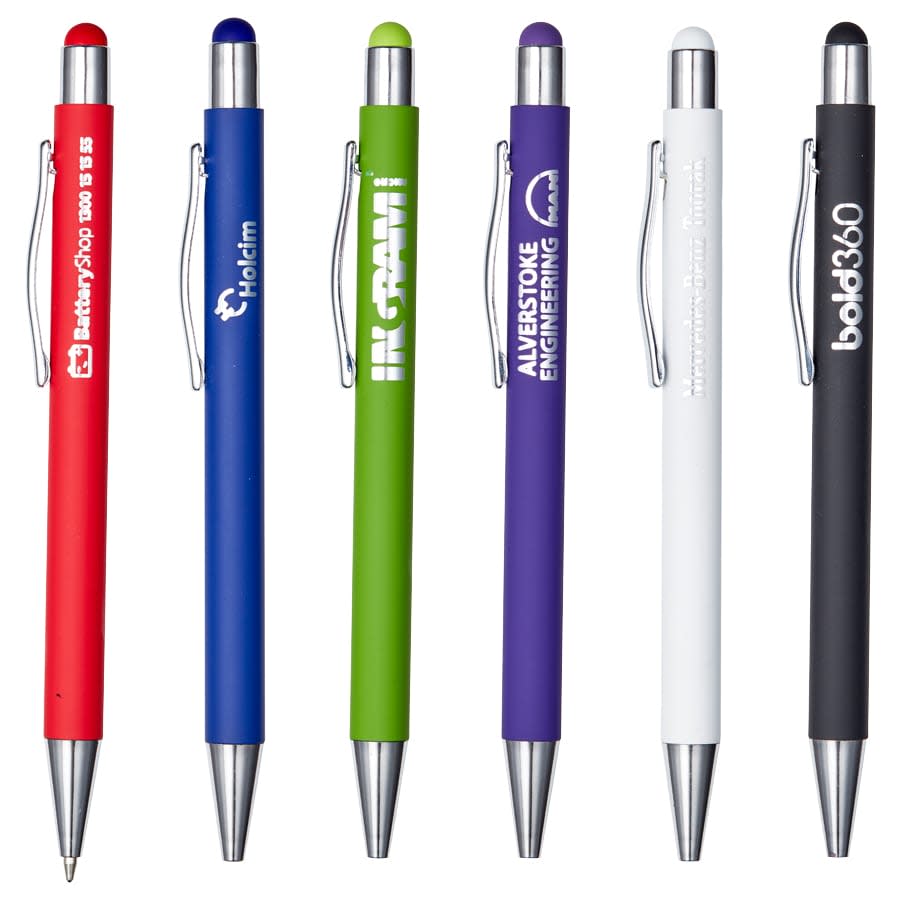 A collection of metal pens in red, blue, green, purple, white, and black, featuring various designs and a logo on each. Manopoli Pen - Image 1